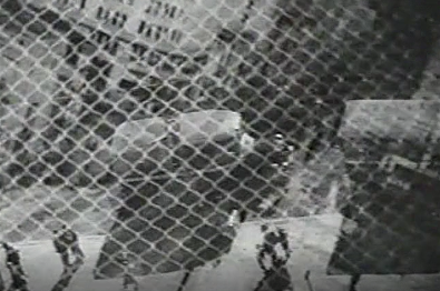 Photo of chain-link fence superimposed on a street