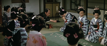 A party of geisha in ancient Japan, with a middle-age man in the background trying to grab a young woman