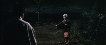 In ancient Japan, at night, a young woman in the middle distance, holding a basket, looks at an approaching man (in the foreground, with his back to us) with trepidation