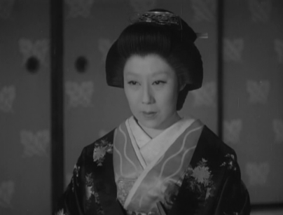 In a traditional Japanese dwelling, a mature woman in the feudal era, wearing traditional kimono, stares at something with a look of dismay